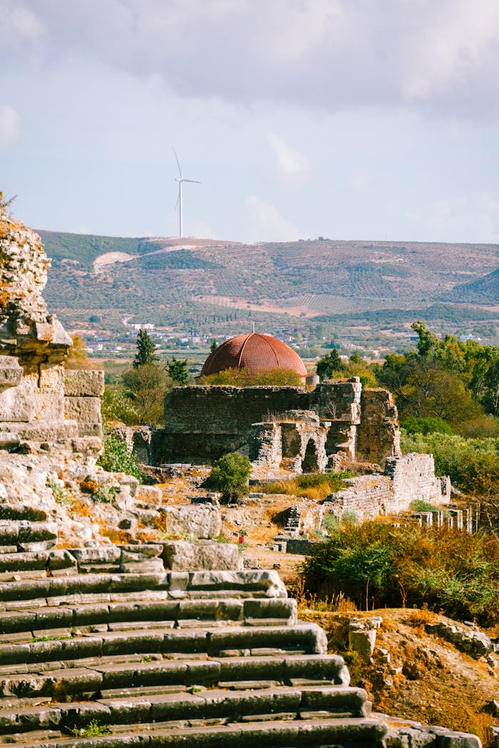 Ancient Ruins and Wind Turbine Landscape View